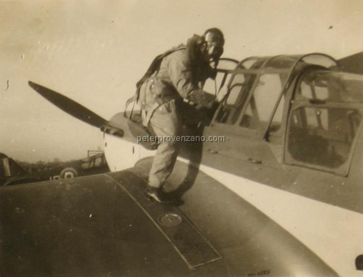 Peter Provenzano Photo Album Image_copy_054.jpg - "Dickie" Dickson climbing into the cockpit of a Miles Master Mark IA.  R.A.F. Station Tern Hill, fall of 1940.
(In Peter's notations he misidentified this pilot as a Leading Aircraftman (LAC), but there would be no reason a LAC (mechanic) would be in flight gear.)